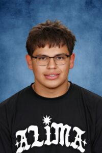 Albuquerque Academy wrestler on podium at state competition.