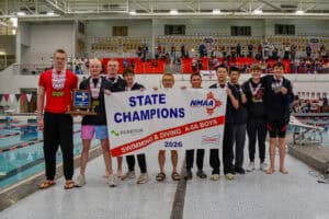 Albuquerque Academy students celebrate swimming and diving state championship victory at the pool.