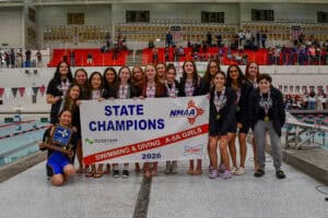 Albuquerque Academy girls' swimming team celebrating state championship victory at the pool.