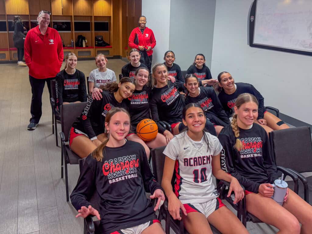 Albuquerque Academy girls basketball team in a classroom, preparing for semifinals.