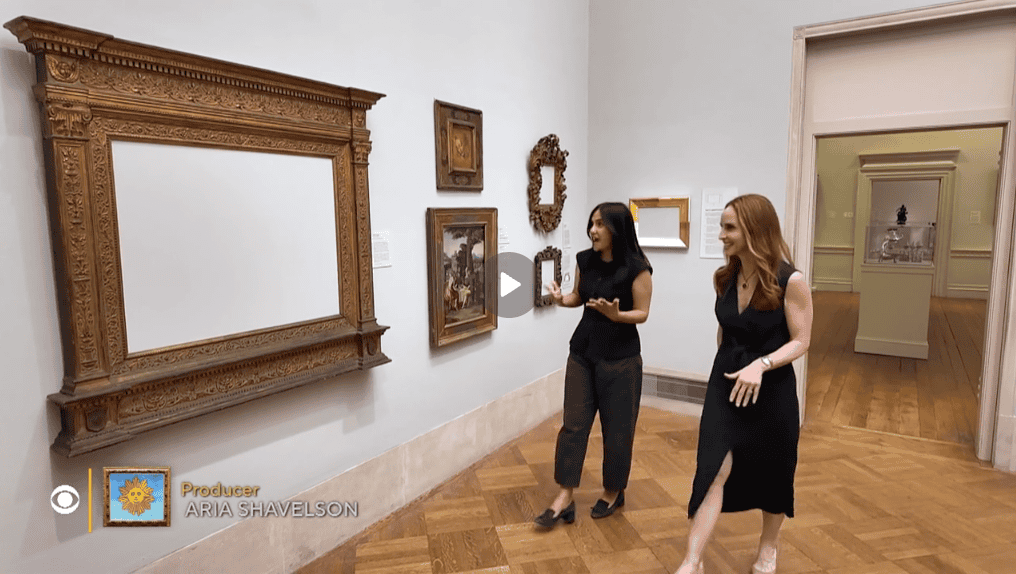 Albuquerque Academy students viewing framed artwork in an art gallery.