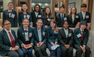 Albuquerque Academy students at HOSA State 2026 event, smiling and posing indoors.