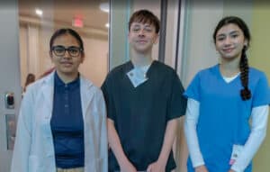 Albuquerque Academy students at HOSA State 2026 event in medical scrubs and professional attire.