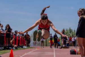 Albuquerque Academy student competing in track and field at Harper track meet.
