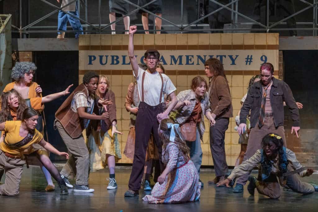 Albuquerque Academy students performing on stage in a theatrical production.