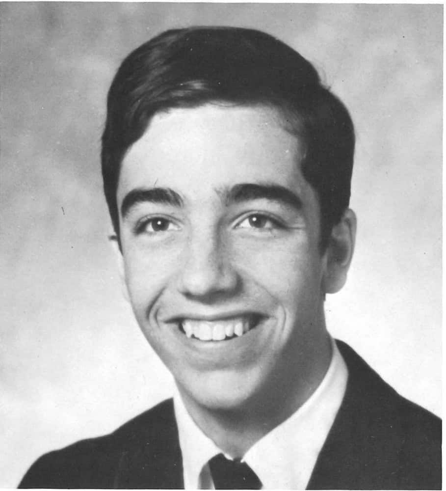 Albuquerque Academy alumni in a black-and-white graduation portrait, celebrating education.