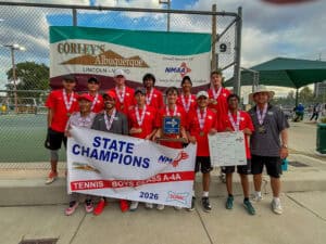 Boys tennis team celebrating state championship victory