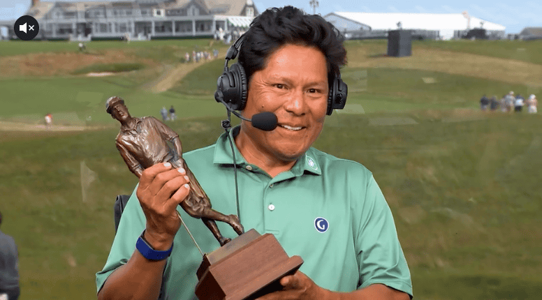 Notah Begay III '90 holding PGA TOUR’s Payne Stewart Award trophy at Albuquerque Academy.