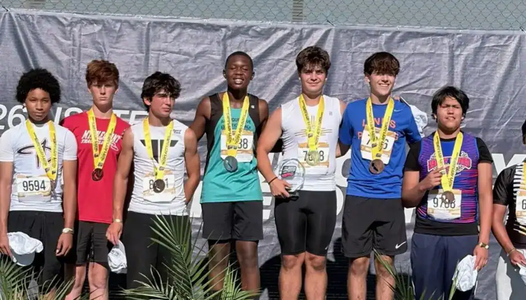 Albuquerque Academy students win medals at a track and field event.