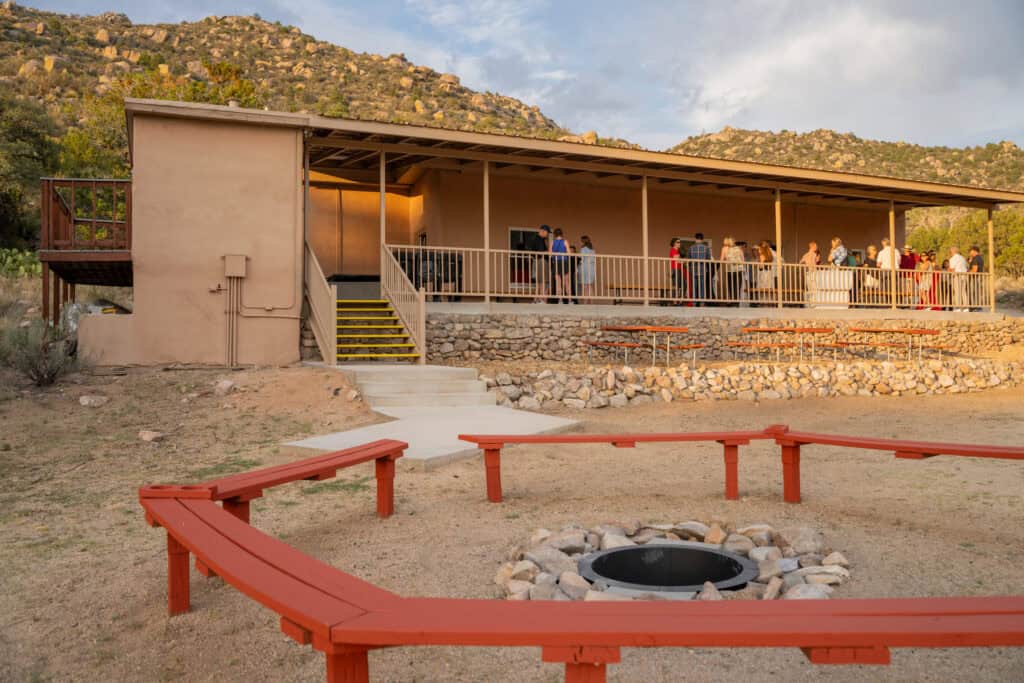 People gather at Albuquerque Academy's outdoor pavilion during renovations at Bear Canyon Recreation.