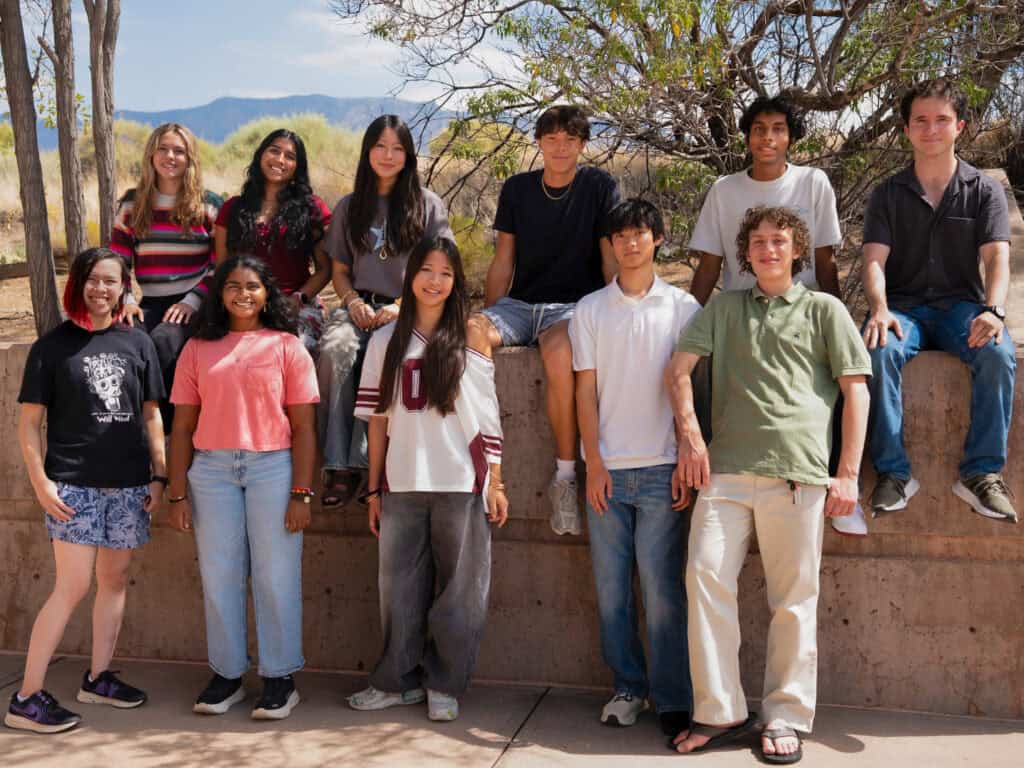 Group of diverse high school students outdoors at Albuquerque Academy.