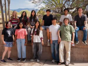 Group of diverse high school students outdoors at Albuquerque Academy.