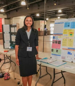 Student presenting science project at Albuquerque Academy science fair event.